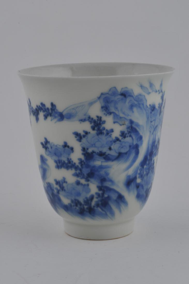 Porcelain cup. Japan. 19th century. Hirado ware. Bell: Porcelain cup. Japan. 19th century. Hirado ware. Bell shaped with underglaze blue decoration of birds and flowers. Old label reading: "By Shinsuke of Hirado 1845". 3-3/4"d. x 4" h. All items in sessio