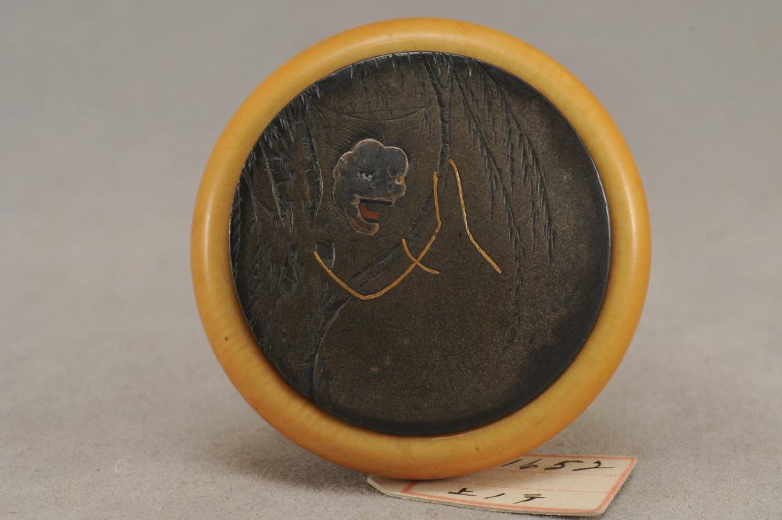 Kagamibuta Netsuke. Japan. ALERT!: Kagamibuta Netsuke. Japan. 19th century. Mixed metal work. Decoration of a painting of a ghost hanging from a willow tree. 1-1/2". All items in session one were collected by William H. Smith (1853-192