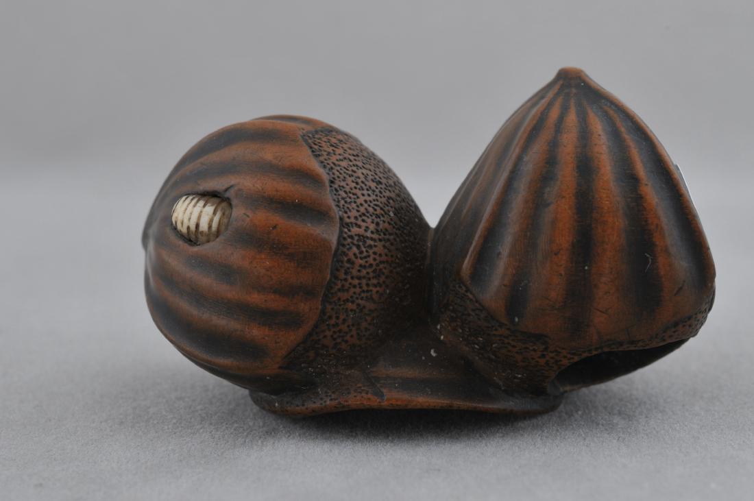 Carved wooden Netsuke. Japan. 18th/19th century. Study: Carved wooden Netsuke. Japan. 18th/19th century. Study of two nuts with a bone worm eating one of them. 1-3/4". All items in session one were collected by William H. Smith (1853-1923)