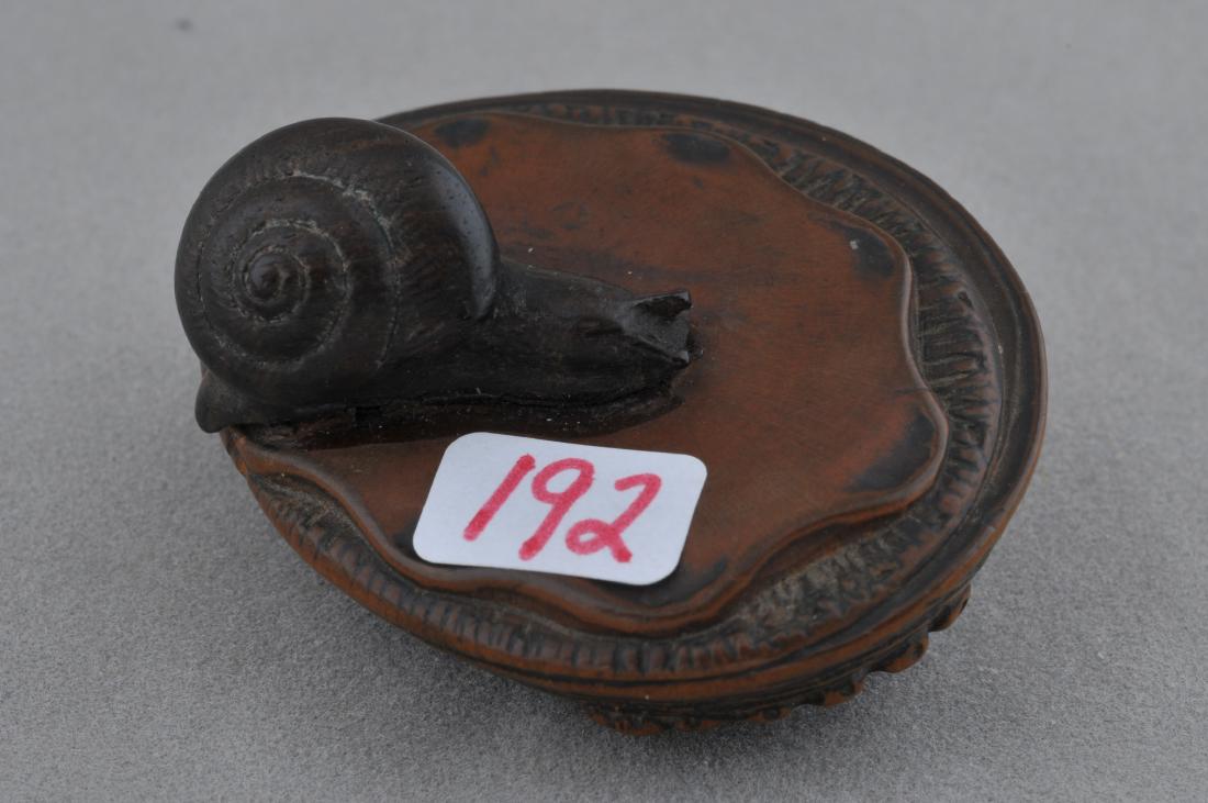 Wooden Netsuke. Japan. 19th century. Study of an: Wooden Netsuke. Japan. 19th century. Study of an abalone and a snail. 2" long. Crack. All items in session one were collected by William H. Smith (1853-1923)