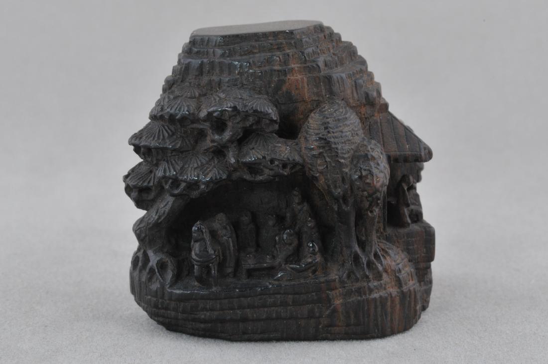Carved wooden Netsuke. Japan. 19th century. Carving of: Carved wooden Netsuke. Japan. 19th century. Carving of a mountain and pavillions. Signed with a lengthy inscription. 1-1/4". All items in session one were collected by William H. Smith (1853-1923)