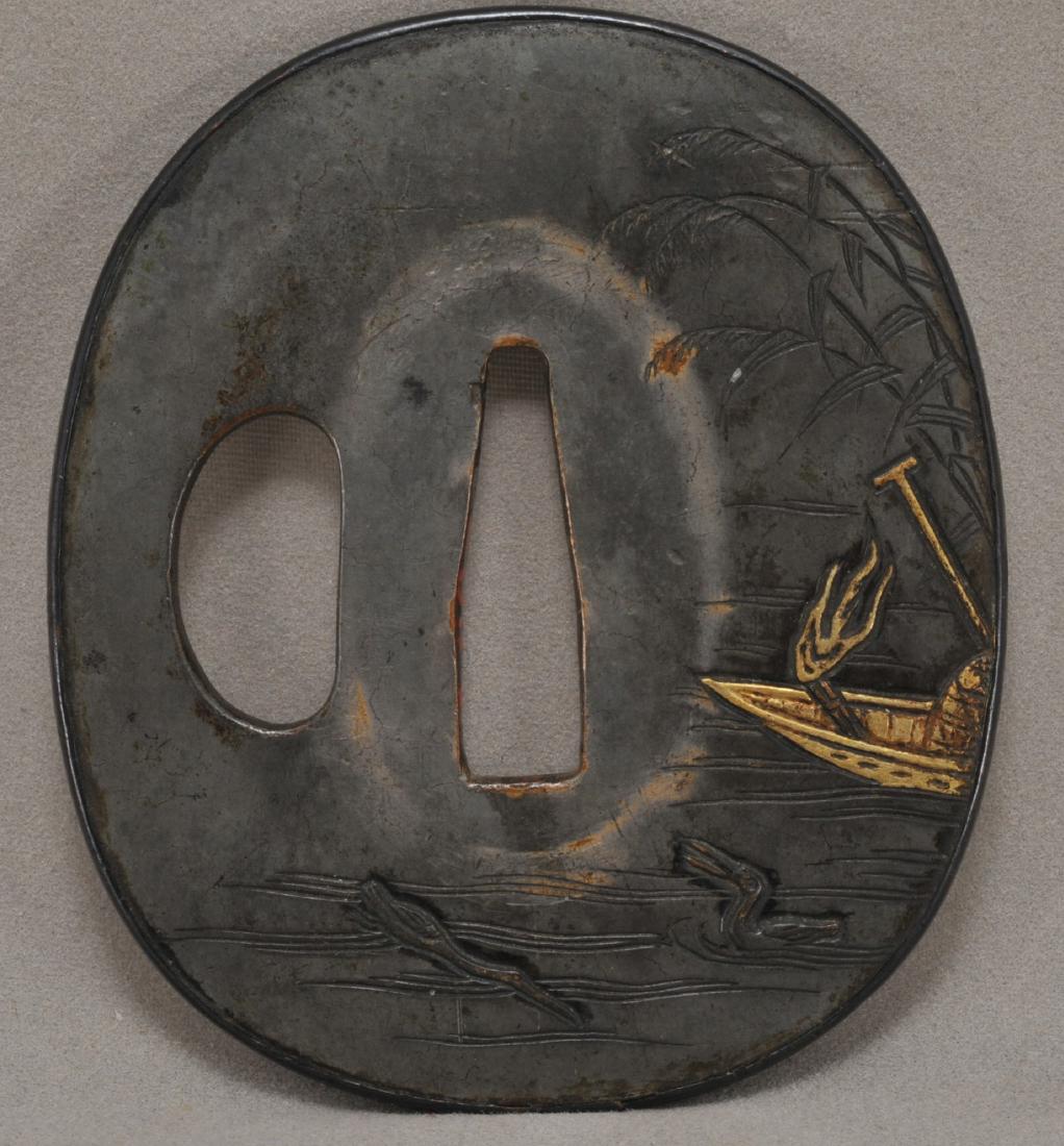 Handguard. Japan. 18th century. Shibucchi inlaid with: Handguard. Japan. 18th century. Shibucchi inlaid with gold. Scene of cormorant fishing. 2-3/4". All items in session one were collected by William H. Smith (1853-1923)
