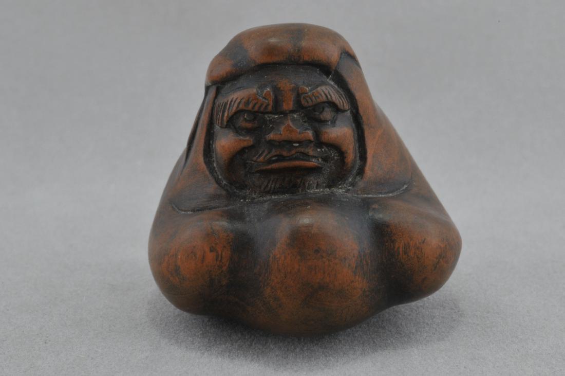 Carved wooden Netsuke. Japan. 18th/19th century. Figure: Carved wooden Netsuke. Japan. 18th/19th century. Figure of Daruma. 1-1/4". All items in session one were collected by William H. Smith (1853-1923)