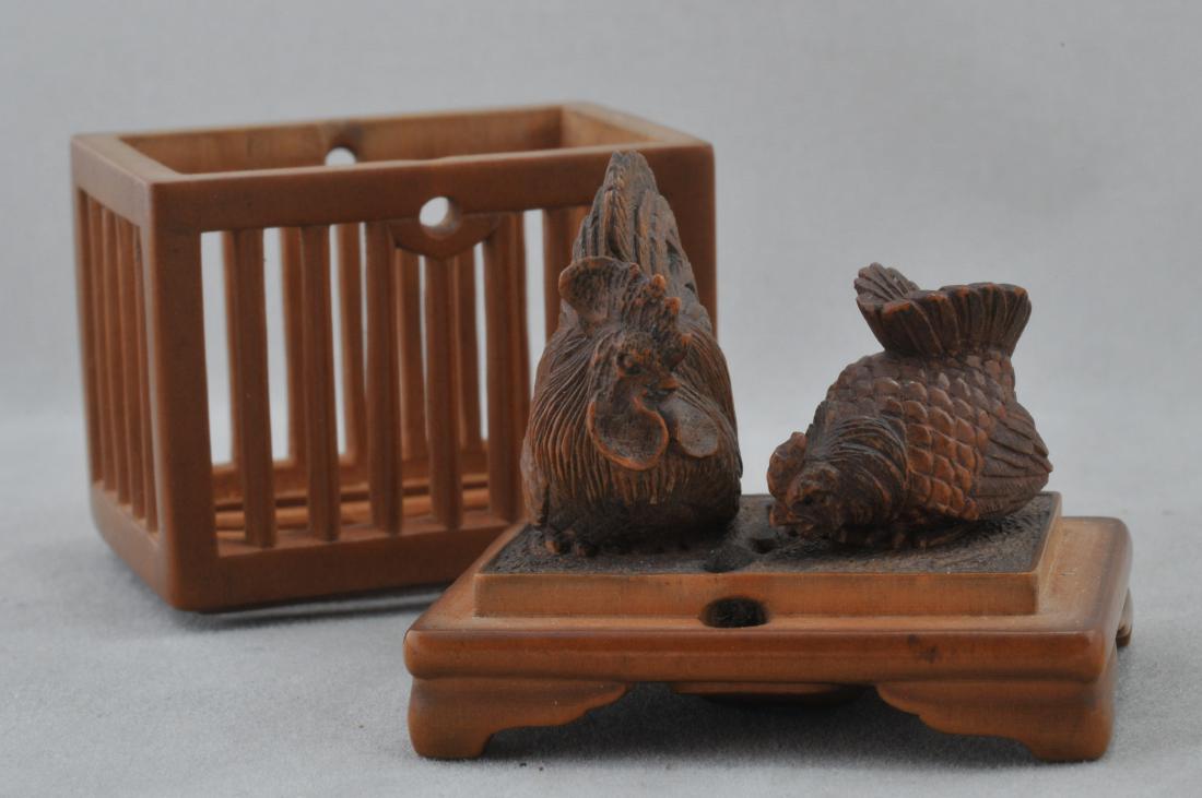Carved wooden Netsuke. Japan. 19th century. Cage with: Carved wooden Netsuke. Japan. 19th century. Cage with two chickens. Signed Masanao. 1-3/4". All items in session one were collected by William H. Smith (1853-1923)
