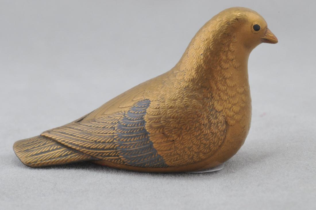 Carved wooden Netsuke. 19th century. Carving of a dove: Carved wooden Netsuke. 19th century. Carving of a dove with a gold lacquered surface. 1-1/2". All items in session one were collected by William H. Smith (1853-1923)