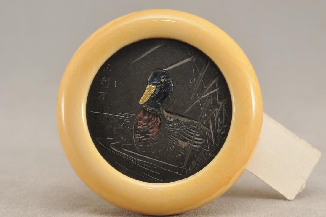 Kagamibuta Netsuke. Japan. 19th century. ALERT!: Kagamibuta Netsuke. Japan. 19th century. Mixed metal inlay engraved with a duck. Signed. 1-1/2". All items in session one were collected by William H. Smith (1853-1923)) ALERT!!! ONLY THE CENTRAL INSE