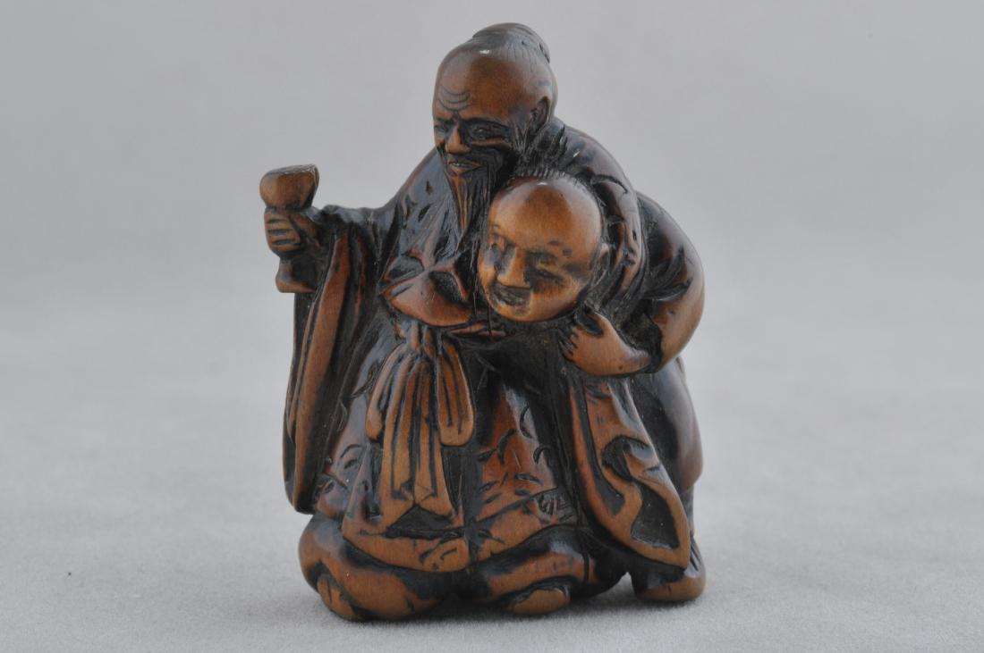 Carved wooden Netsuke. Japan. 19th century. Carving of: Carved wooden Netsuke. Japan. 19th century. Carving of the Tang period poet Li Po with an attendant. 1-3/4". All items in session one were collected by William H. Smith (1853-1923)