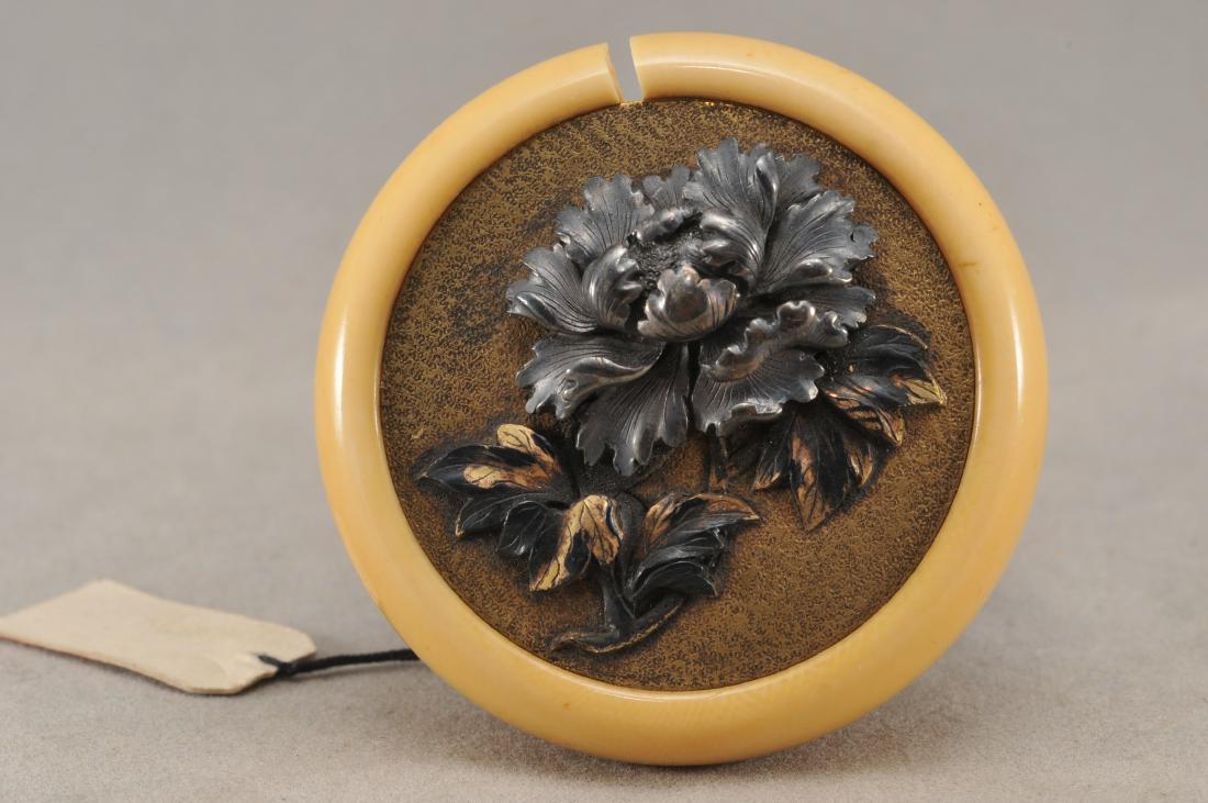 Kagamibuta Netsuke. Japan. 19th century. ALERT!: Kagamibuta Netsuke. Japan. 19th century. Mixed metal work. Decoration of a flowering peony. 2". All items in session one were collected by William H. Smith (1853-1923)) ALERT!!! ONLY THE CENTRAL INSER