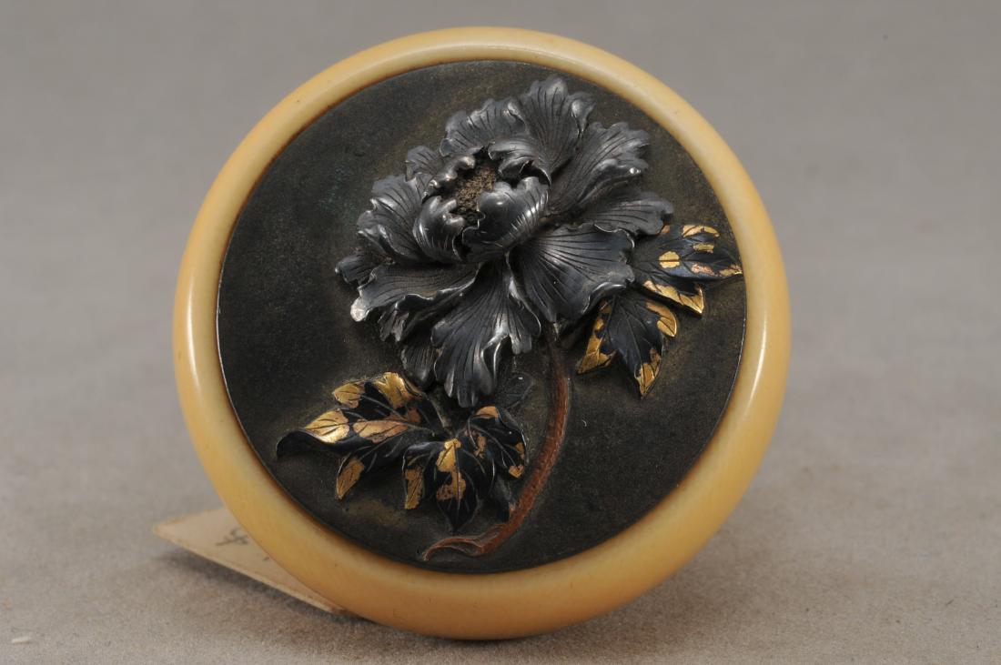 Kagamibuta Netsuke. Japan. 19th century. ALERT!: Kagamibuta Netsuke. Japan. 19th century. Mixed metal work. High relief decoration of peony flowers and foliage. 1-3/4". All items in session one were collected by William H. Smith (1853-1923)) ALERT!!