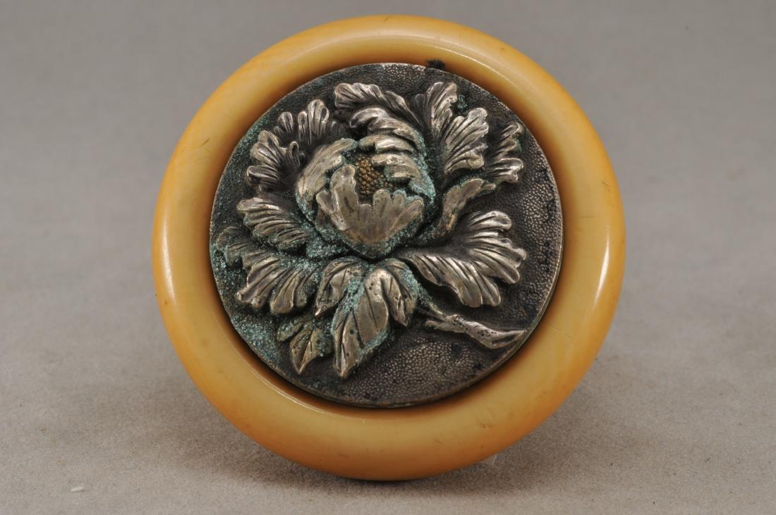 Kagamibuta Netsuke. Japan. 19th century. ALERT!: Kagamibuta Netsuke. Japan. 19th century. Silvered metal with relief decoration of a peony flower. 2". All items in session one were collected by William H. Smith (1853-1923)) ALERT!!! ONLY THE CENTRAL