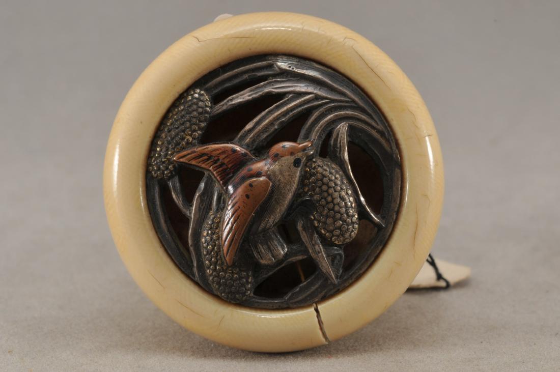 Kagamibuta Netsuke. Japan. 19th century. ALERT!: Kagamibuta Netsuke. Japan. 19th century. Mixed metal decoration of a bird and millet plants. 1-3/4" crack. All items in session one were collected by William H. Smith (1853-1923)) ALERT!!! ONLY THE CE
