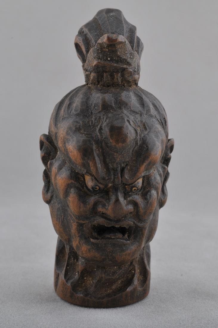 Carved wooden Netsuke. Japan. 19th century. Head of a: Carved wooden Netsuke. Japan. 19th century. Head of a Nio Guardian figure. 2-3/4". All items in session one were collected by William H. Smith (1853-1923)