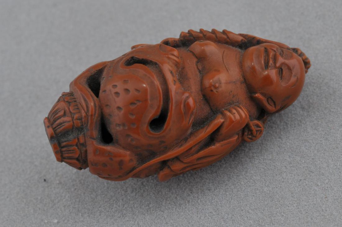 Carved fruit pit. China. 19th century. Figure of Liu (1 of 5)