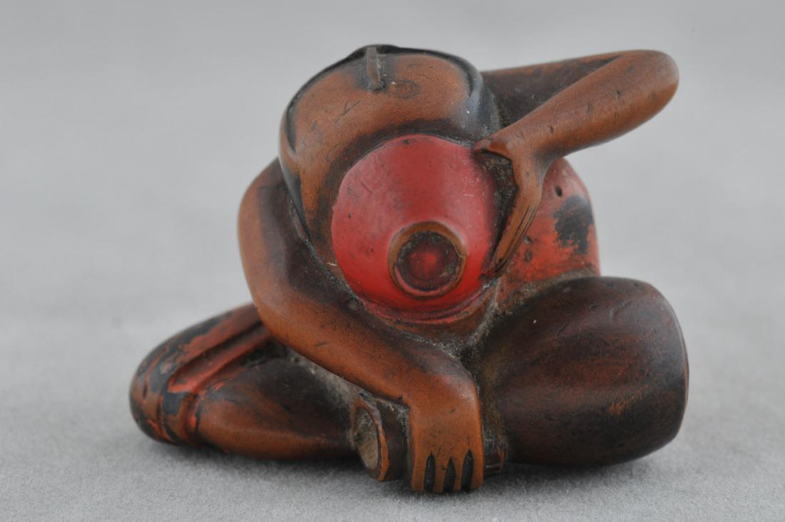 Carved wooden Netsuke. Japan. 19th century. Man: Carved wooden Netsuke. Japan. 19th century. Man drinking sake. Surface of negoro lacquer. 1". All items in session one were collected by William H. Smith (1853-1923)