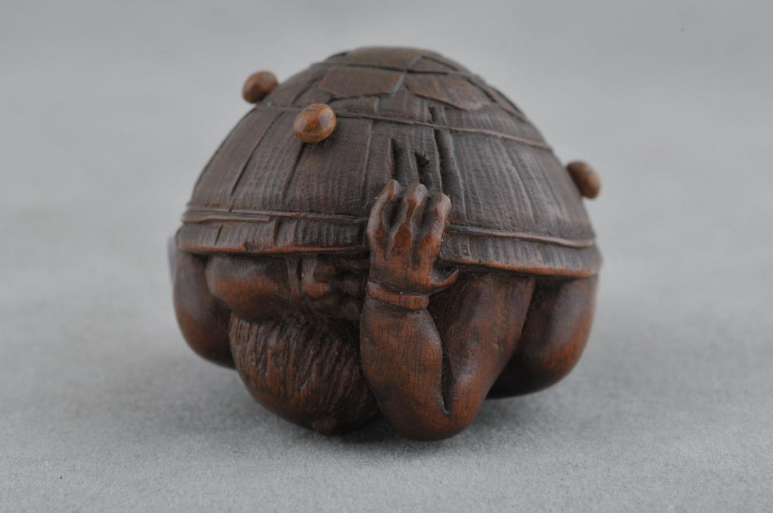 Carved wooden Netsuke. Japan. 19th century. Oni hiding: Carved wooden Netsuke. Japan. 19th century. Oni hiding under a hat. Signed Shingyoku. 1-1/2". All items in session one were collected by William H. Smith (1853-1923)