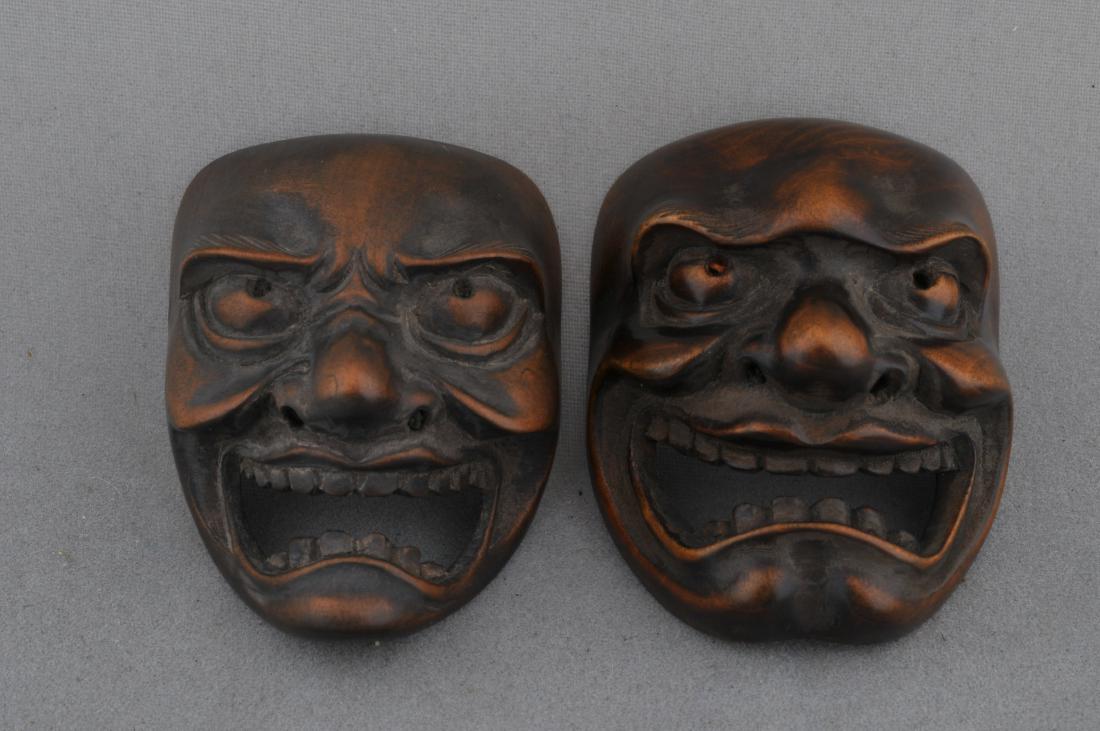 Lot of two wooden mask Netsukes. Japan. 19th century. (1 of 3)