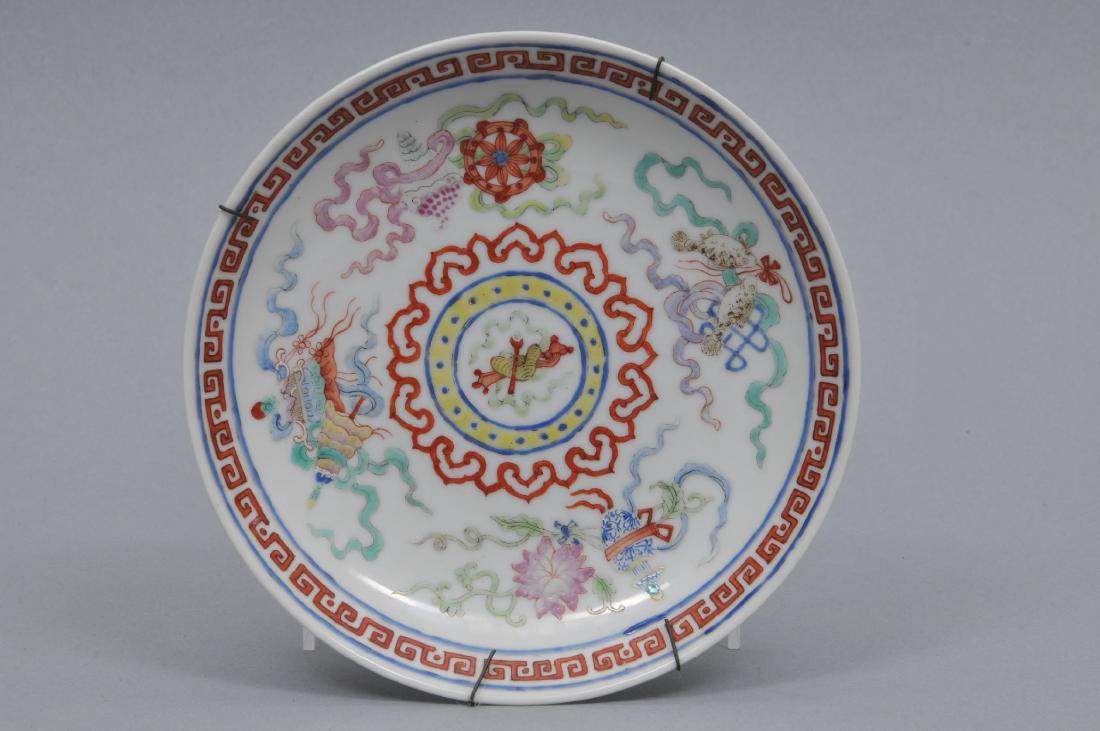 Porcelain saucer dish. China. Tung Chih mark: Porcelain saucer dish. China. Tung Chih mark (1861-1874) and of the period. Famille Rose decoration of "The Eight Precious Emblems". 5-3/4" d.