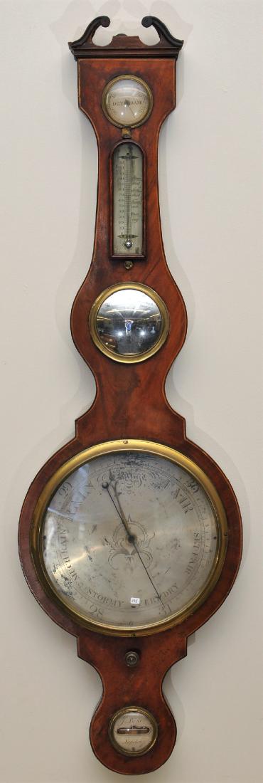 An English oversized banjo barometer of select San: An English oversized banjo barometer of select San Domingan mahogany having fine old if not original finish, engraved silver dials, the bottom leveling dial engraved J. Lione, London. Mercury tubes ar
