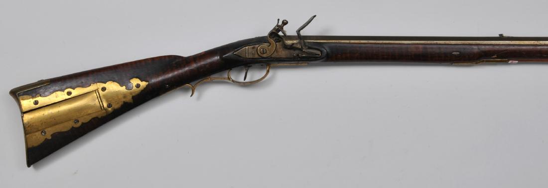 Unsigned Rifle 59-1/4" overall .47 Cal. 43-1/2" BBL.: Unsigned Rifle 59-1/4" overall .47 Cal. 43-1/2" BBL. smooth bore octagon to round with spear pointed tang. Unmarked French style 5"x7/8" lock. Scrolling with some remnants of Brass inlay throughout Bu