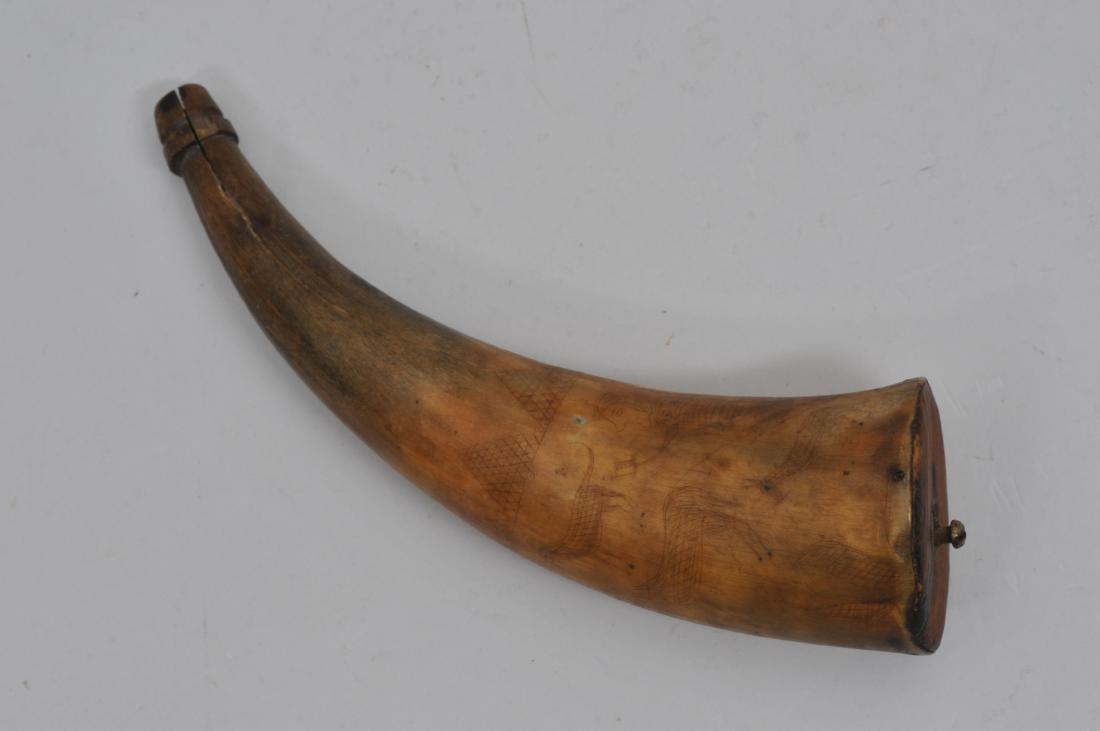 Period 8" reused Powder Horn. This horn is identified: Period 8" reused Powder Horn. This horn is identified by two different people during use. "R...N. PARMILEE" is engraved around the top center of horn and also what appears to read "DANIEL BRETTS" that