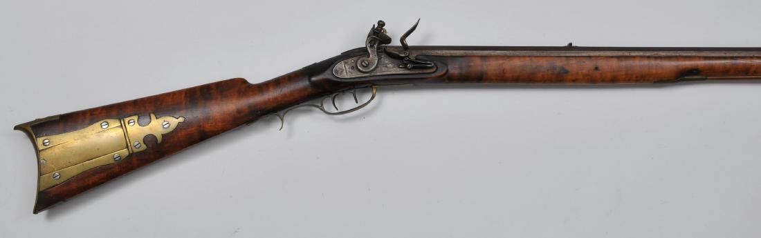 Signed "J LUTZ" and "B BRADLEY" Rifle 60" overall .36: Signed "J LUTZ" and "B BRADLEY" Rifle 60" overall .36 Cal. 43-1/4" BBL. six groove octagon with wide pointed tang. Unmarked 4-1/5"x1" lock with a roller frizzen and engraving. Silver inlayed oval Eagl