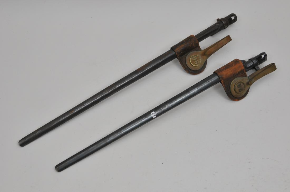 Lot of two post civil war bayonets with scabbards. Both: Lot of two post civil war bayonets with scabbards. Both are stamped "US" on the neck flat. Condition: As found light rust and dirt.