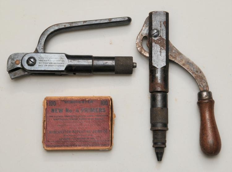 Lot of three items. Two loading tools a Winchester: Lot of three items. Two loading tools a Winchester 32-40 and a Savage 38-55. Also a box containing four number 4 Winchester primers.