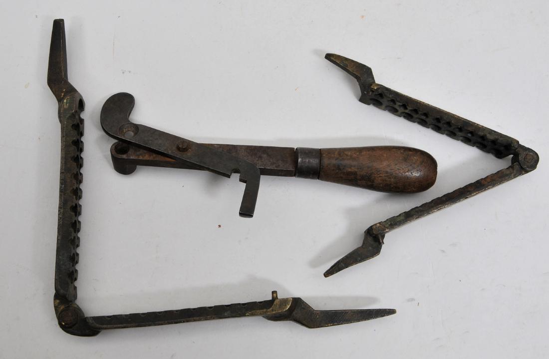 Lot of three bullet molds. Two are early Brass gang: Lot of three bullet molds. Two are early Brass gang molds and one has a large .60 Cal. Ball in the gang. One is an unusual single shot iron mold. There is an observed mark of "IM" on the large gang mo