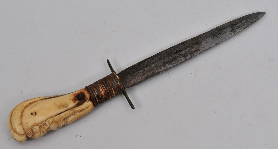 19th century Naval dagger. 9-7/8" overall with a 5-3/4": 19th century Naval dagger. 9-7/8" overall with a 5-3/4" blade. The hilt has a figure of a woman protected by a hand with wire wrapped at the recaso. Screw holds tang to hilt. No markings. Condition: B
