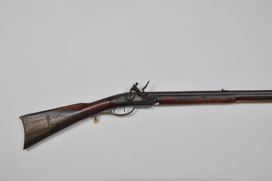 Unsigned rifle 56-1/4" overall .44 Cal. 41-1/2" seven: Unsigned rifle 56-1/4" overall .44 Cal. 41-1/2" seven groove octagon BBl with a 2-1/2" full point tang. "LONDON WARRANTED" stamped 4-1/2"x7/8" lock with a roller Frizzen and engraving at pan and rear 
