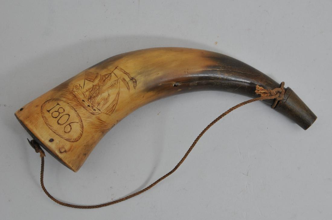 19th century 8" Powder Horn dated "1806". The horn is: 19th century 8" Powder Horn dated "1806". The horn is decorated with one full sail Ship with cannons, a small Boat both have flags, a Meeting House, a Musket, and the letter "E". Condition: Cracks at