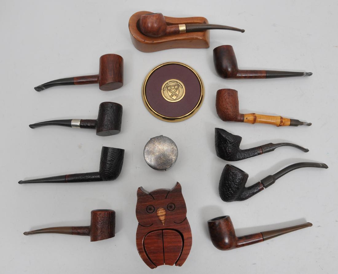 Estate Lot of Vintage Pipes. Includes ten pipes by: Estate Lot of Vintage Pipes. Includes ten pipes by various makers including Dunhill and Stanwell. One with a 14KT band. Also included are a pipe rest, wooden owl tobacco box, round sterling box and Ha