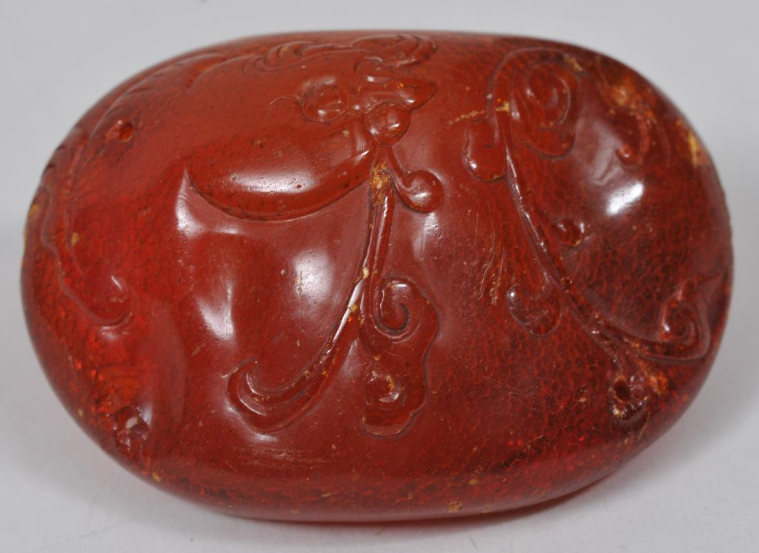 Hat button. China. 18th/19th century. Amber carved with (1 of 5)
