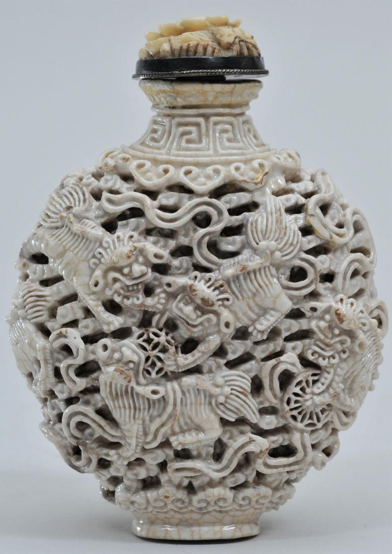 Snuff bottle. 19th century. White porcelain carved with (1 of 6)