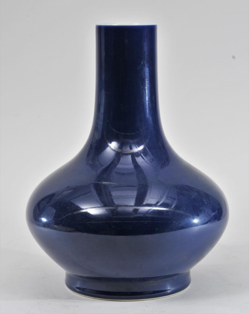 Porcelain vase. China. 20th century. Bottle form. Dark: Porcelain vase. China. 20th century. Bottle form. Dark cobalt blue monochrome. Ch'ien Lung mark. 12-1/2" high.