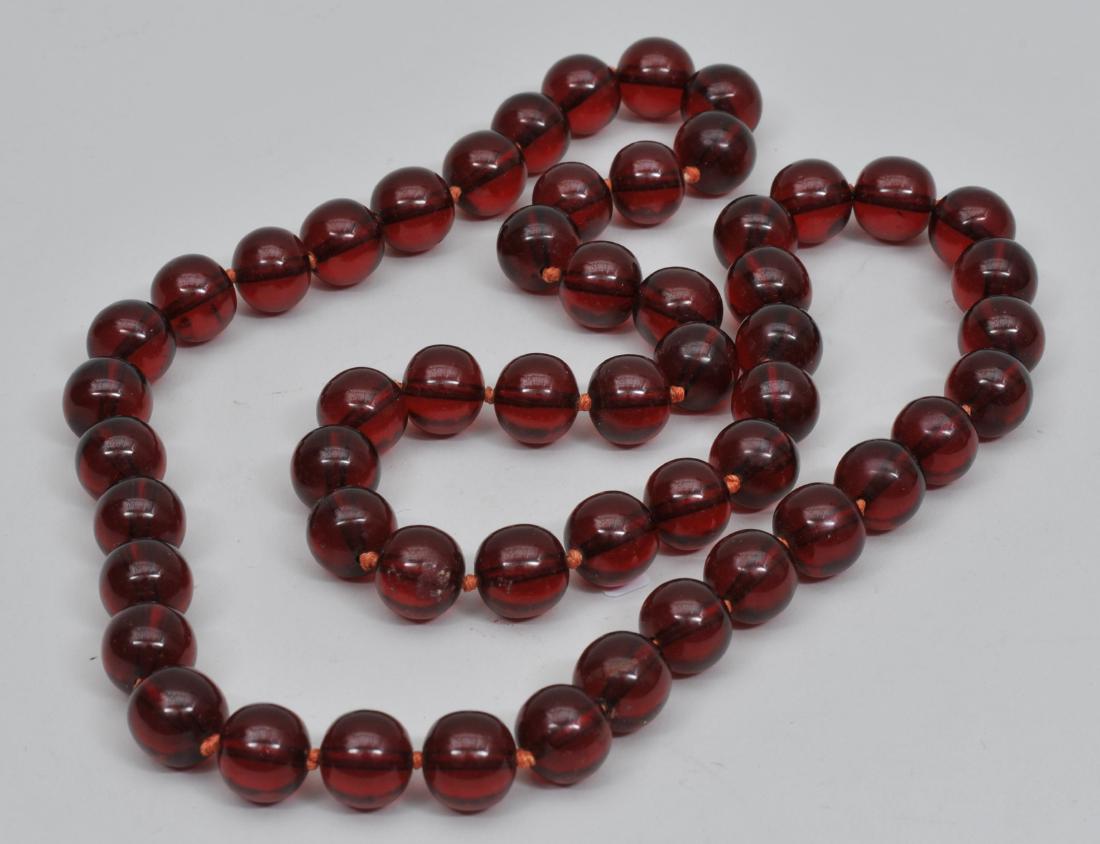 Set of amber beads. Cherry colour. Each bead approx. (1 of 5)