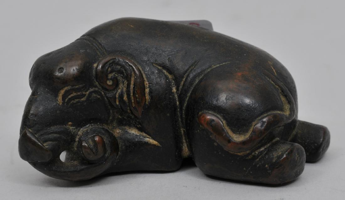 Bronze paperweight. China. 18th century. Study of a: Bronze paperweight. China. 18th century. Study of a reclining elephant. 2-1/4" long.