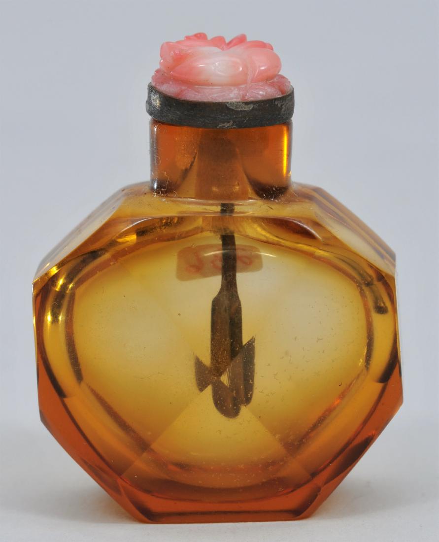 Snuff bottle. China. 19th century. Faceted amber glass. (1 of 5)