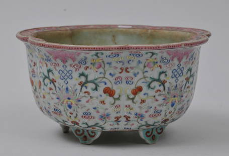 Porcelain jardinière. China. 19th century. Lobated: Porcelain jardinière. China. 19th century. Lobated form. Famille Rose decoration of bats, endless knots and stylized lotus scrolls. 6-3/4" diameter x 3-1/2" high. From the Estate of Jeanette Curuby