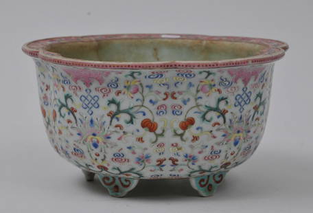 Porcelain jardiniÃ¨re. China. 19th century. Lobated: Porcelain jardiniÃ¨re. China. 19th century. Lobated form. Famille Rose decoration of bats, endless knots and stylized lotus scrolls. 6-3/4" diameter x 3-1/2" high. From the Estate of Jeanette Curuby