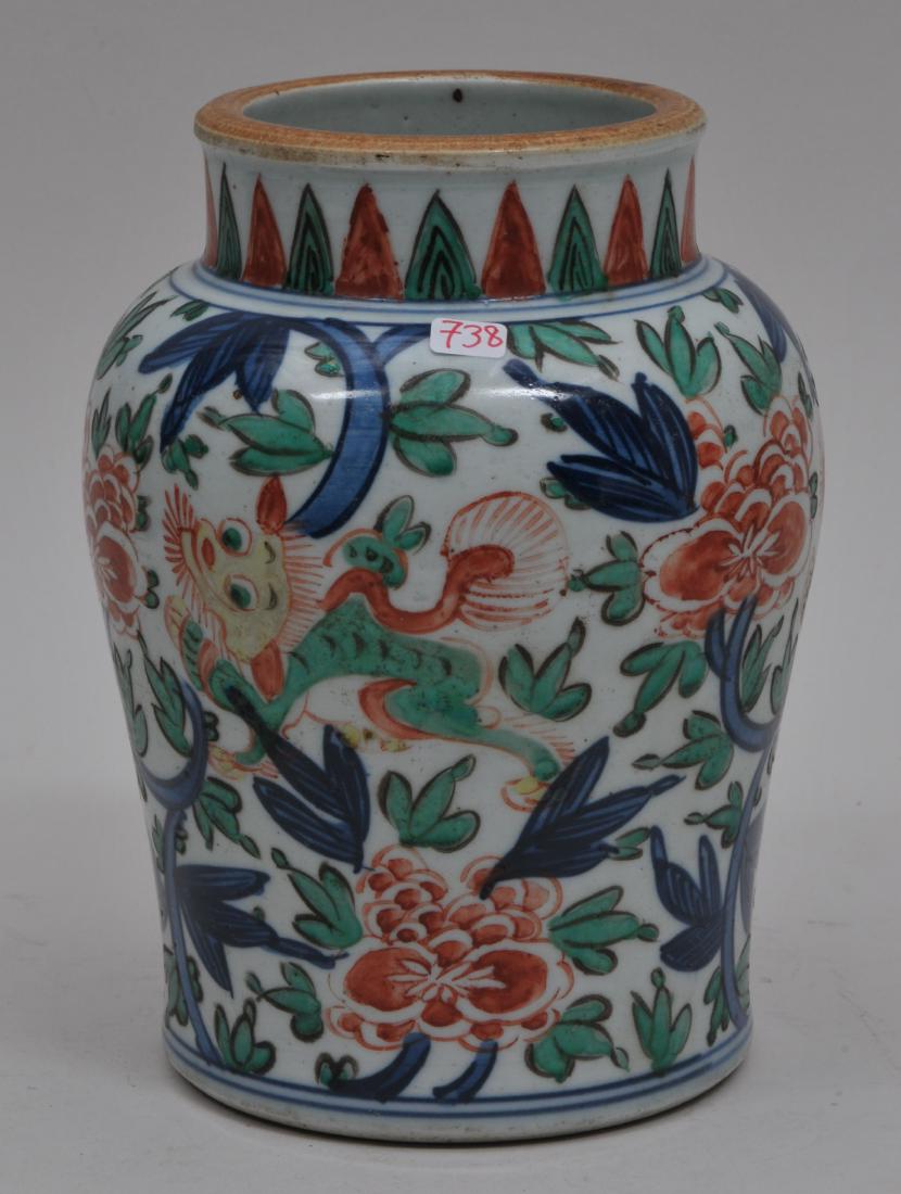 Porcelain vase. China. 18th century. Wu Tsai ware: Porcelain vase. China. 18th century. Wu Tsai ware decoration of Foo Dogs and Peonies. 7" high.