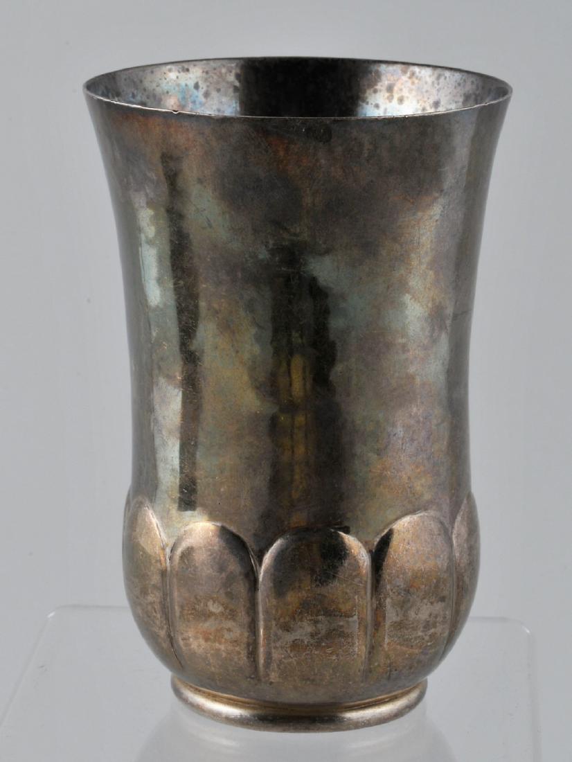 Hand wrought Sterling silver beaker with melon form: Hand wrought Sterling silver beaker with melon form base. 4-1/2" high. 6.1 ozt.
