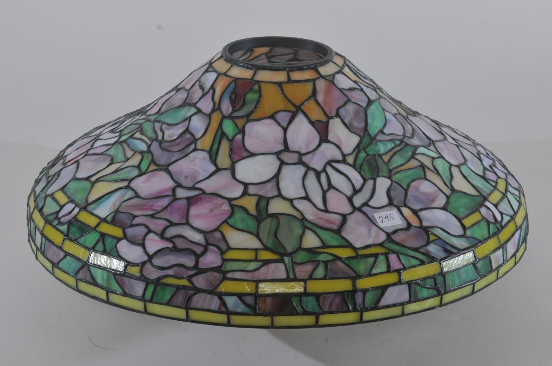 Antique leaded glass shade possibly by Tiffany Studios.: Antique leaded glass shade possibly by Tiffany Studios. Dogwood pattern. Fine quality. Good condition. Bronze top rim. From the estate of famous decorator and friend of Louis Tiffany. Lockwood DeFores