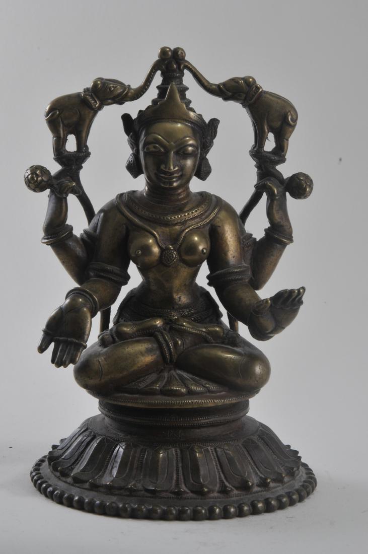 Bronze divinity. India. 15th century. Seated figure of (1 of 5)