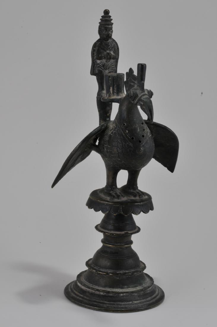 Bronze censer. India. 17th century. Figure of a peacock: Bronze censer. India. 17th century. Figure of a peacock and votive figure. 10".