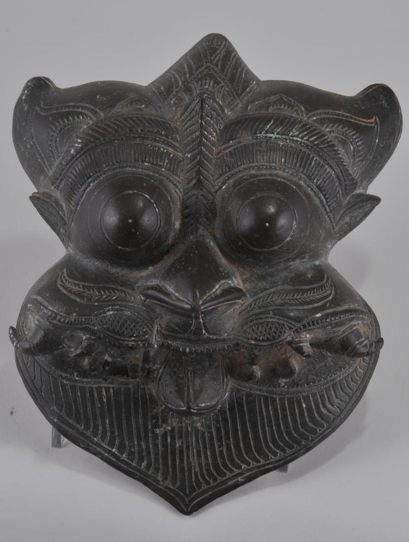 Bronze mask. India. 17th century. Demon form. 8" x 6". (1 of 4)