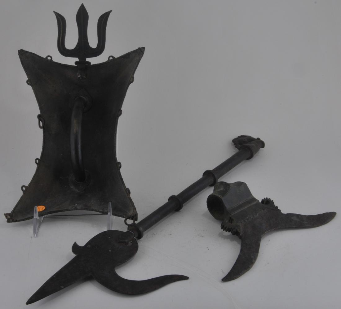 Lot of three items. India. 19th century. To include: An: Lot of three items. India. 19th century. To include: An elephant goad, buckler shield and an oxe head. Largest- 19" long.