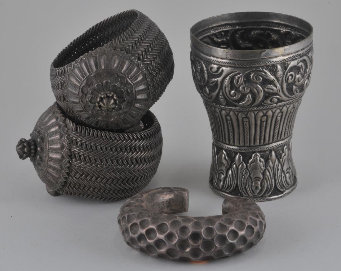 Four silver items. India. 19th century. A cup, pair of (1 of 5)