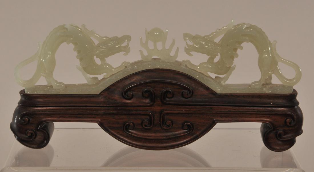 Jade carving. China. 20th century. Two dragons confront (1 of 6)