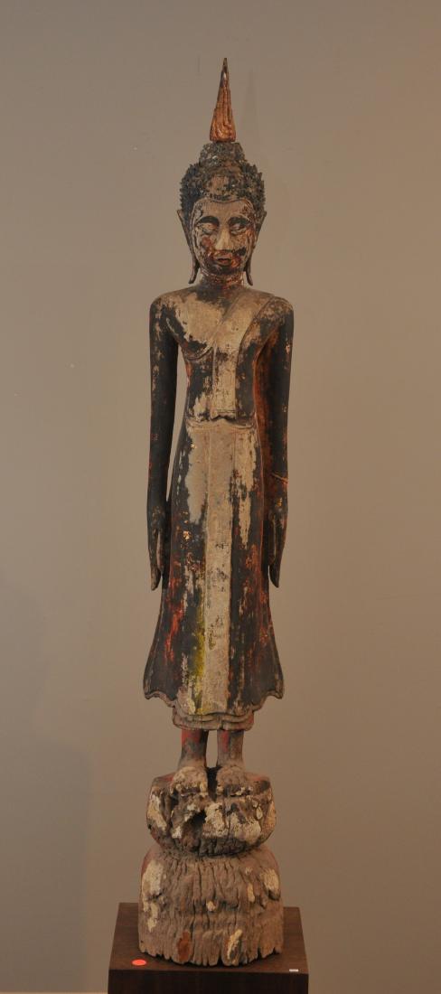 Wood statue. Thailand. Circa 1920. Standing image of (1 of 10)